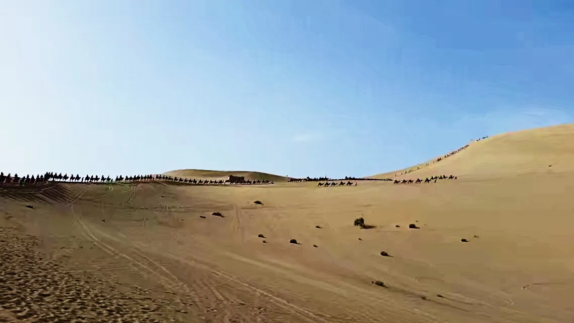 Dunhuang cave mural showing camel caravan along the Silk Road